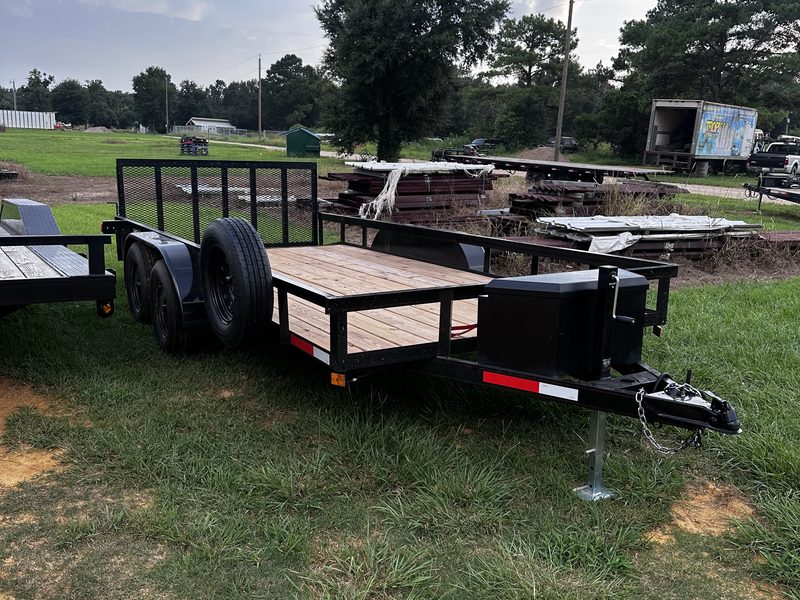 The 16 by 7 utility trailer parked with its ramp gate up, ready to load